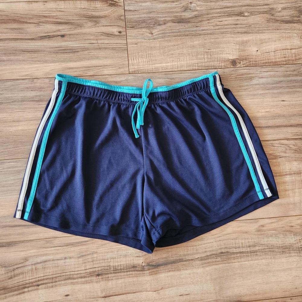 Made for Life navy blue athletic shorts with turquoise and white side stripes.